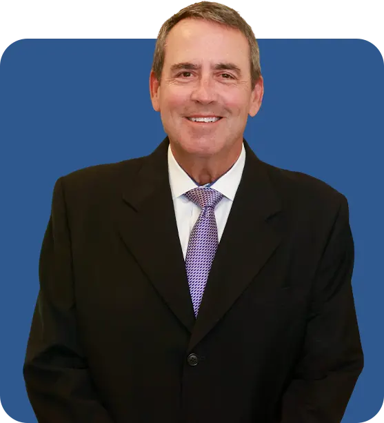 A professional, smiling portrait of Greg Reese, President and CEO of AmeriEstate Legal Plan
